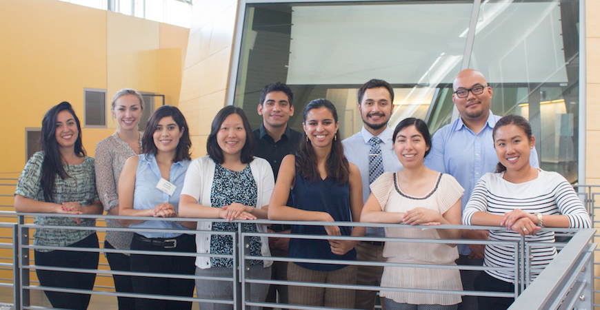 Ten students in entering SJV PRIME class pose in front of a conference room at the University of California, Merced.